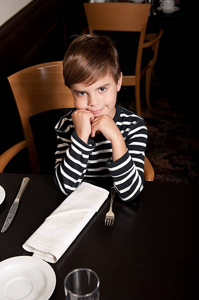 istock Young boy waiting for his meal 183819136