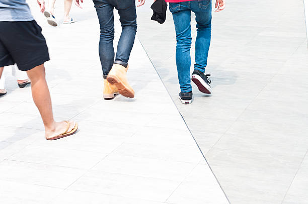 High Key Photo Of Pedestrians Feet At A Busy Shopping Centre