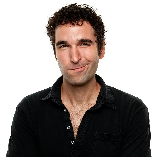 istock Smirking man with shirt unbuttoned and curly hair 183819591