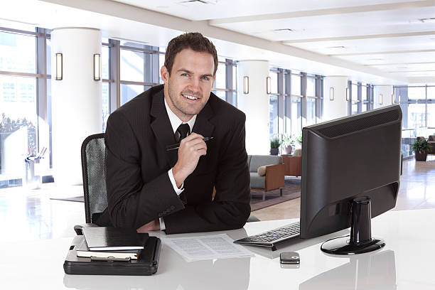 istock Businessman at desk in office 183821190