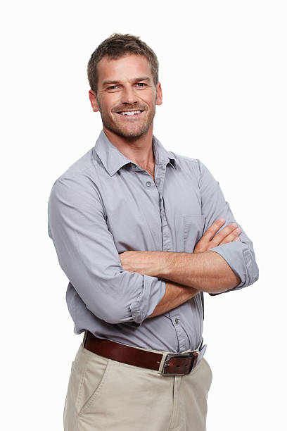 Casual man smiling Portrait of casual man standing with hands folded and smiling on white background rolled up sleeves stock pictures, royalty-free photos & images
