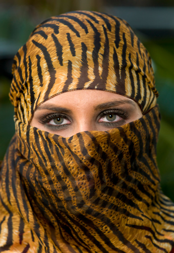Close up picture of a beautiful middle eastern young woman wearing a religious veil looking at the camera (this picture has been taken with a Hasselblad H3D II 31 megapixels camera)