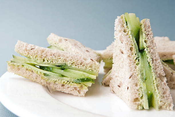 istock Triangles of cucumber sandwich on a white plate 183821634
