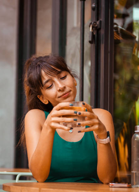 istock Pretty young lady is drinking a ice latte. 1838216726