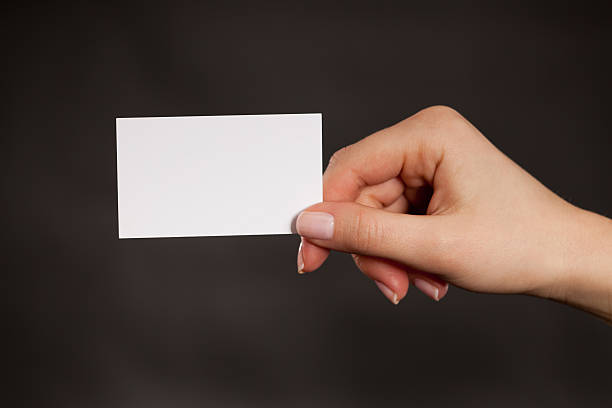istock Holding a blank white business card 183821680