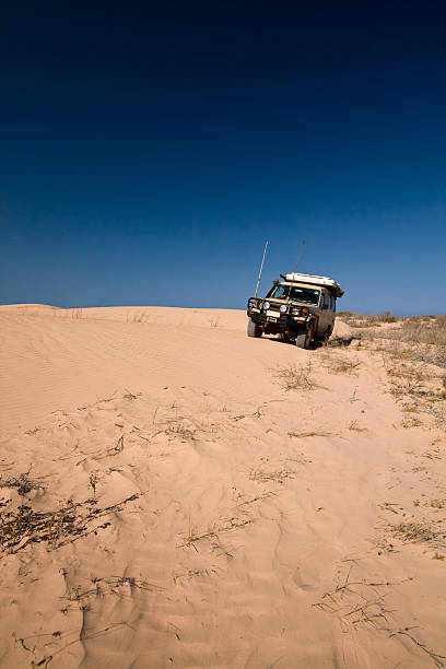 Cape Range National Park Off-Road An off-road vehicle tackling the seemingly endless sand dunes in Cape Range National Park.  Cape Range National Park borders the waters of the famous Ningaloo Reef in central Western Australia. cape range national park photos stock pictures, royalty-free photos & images