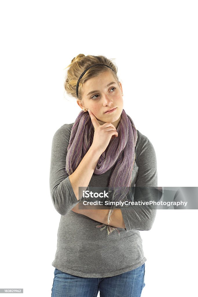 Teen Girl Contemplating A teenage girl looking off to the distance in deep contemplation.Similar Images: 14-15 Years Stock Photo