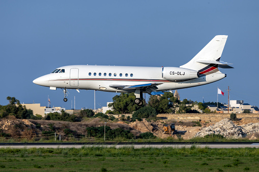 Luqa, Malta - October 8, 2023: NetJets Dassault Falcon 2000EX EASy (REG: CS-DLJ) landing runway 31.