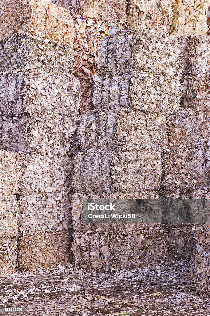 Giant Paper Towers "Shot of huge stacked paper bales at a paper recycling plant, bales are ready for recycling." Paper Stock Photo