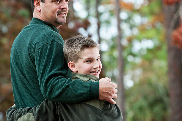 istock Rear view of father and son at park 183823354
