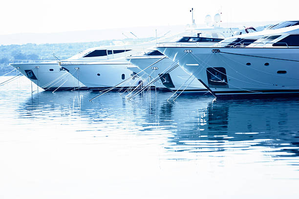 floating luxury "luxury mega yachts moored in marina, toned imageCHECK OTHER SIMILAR IMAGES IN MY PORTFOLIO...." Marina stock pictures, royalty-free photos & images