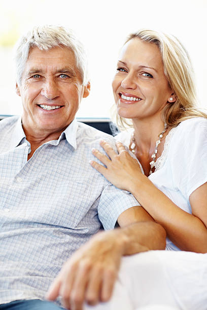 istock Happy, relaxed couple sitting together 183824460