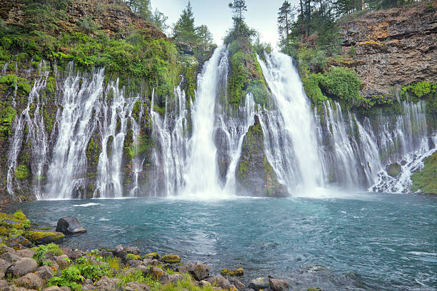 Burney Falls dusk from bottom "After sunset view at the bottom of Burney Falls in McArthur-Burney Falls Memorial State Park, Shasta County, California." burney falls stock pictures, royalty-free photos & images