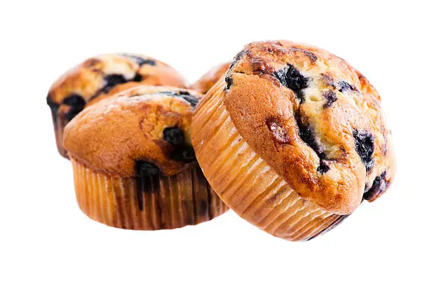 Stock photo of a stack of blueberry muffins isolated on a white background.