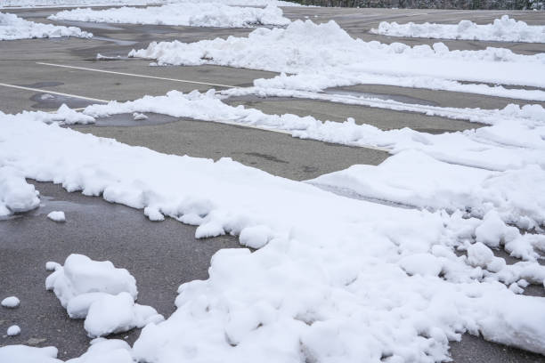 istock parking lots with snow in winter 1838248190