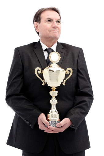 businessman holding golden cup