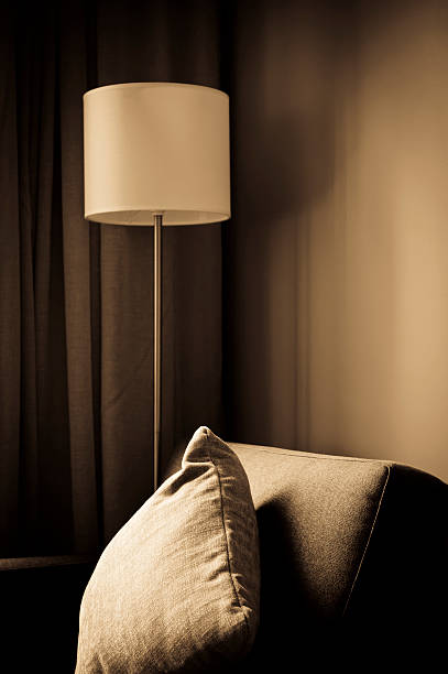 istock Hotel lamp and sofa in sepia light 183825606