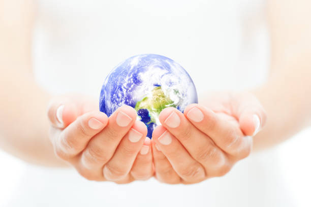 istock Planet Earth held in a woman's cupped hands 183826227