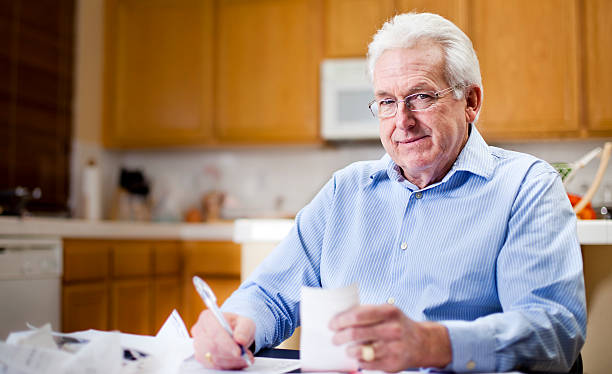 istock Senior Business Man Working in Kitchen 183826322