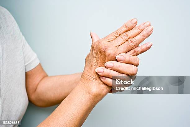 Elderly Woman With Arthritis In Her Hands Stock Photo - Download Image Now - Arthritis, Wrinkled, Senior Adult