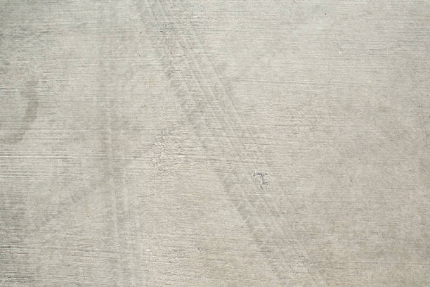 Closeup surface concrete floor with tire tracks textured background