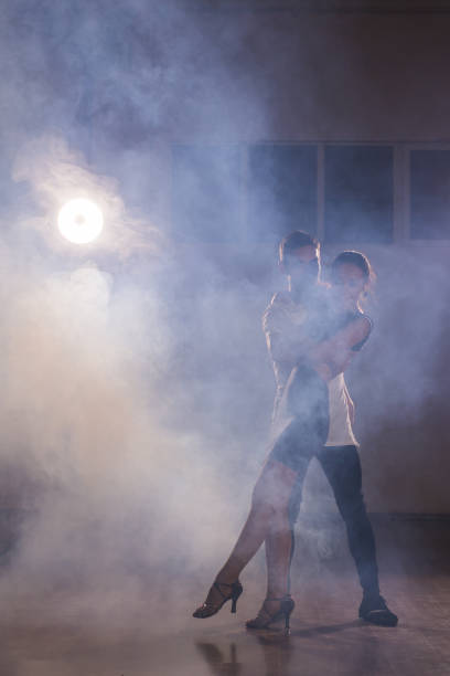 istock Young couple dancing latin dance Bachata, merengue, salsa. Two elegance pose in dance class copy space and empty space for text 1838267777