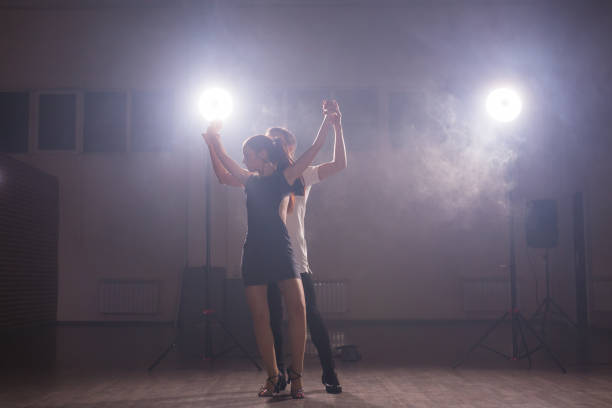 istock Young couple dancing latin dance Bachata, merengue, salsa. Two elegance pose in dance class copy space and empty space for text 1838267801