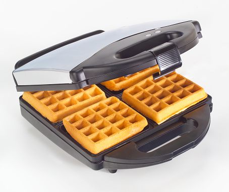 Modern waffle maker, on white with soft shadow.