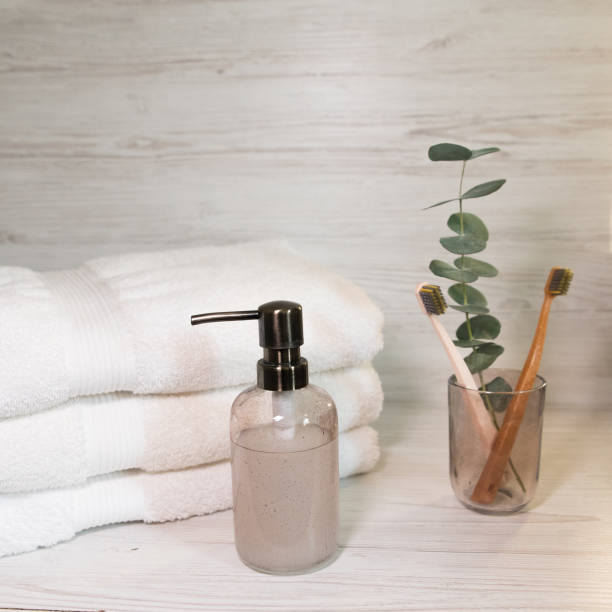istock soap dispenser and toothbrush holder on white towels background 1838270951