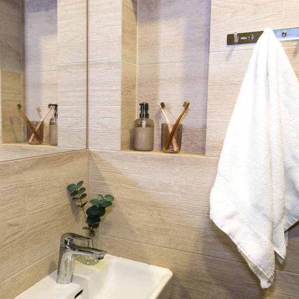 istock bathroom, soap dispenser, white towel, toothbrush holder 1838271469