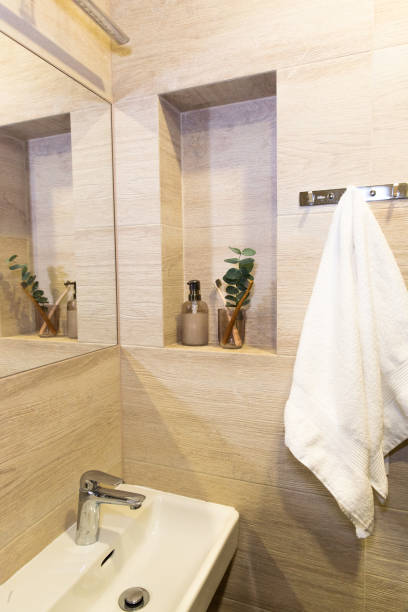 istock bathroom, soap dispenser, white towel, toothbrush holder 1838271483