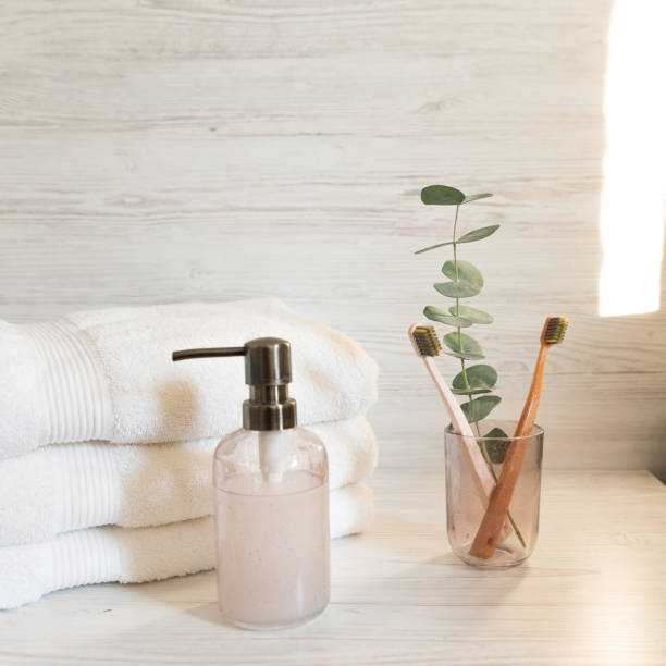 istock soap dispenser and toothbrush holder on white towels background 1838272016