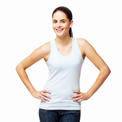 Portrait of a young woman wearing a tank top and jeans. She is looking at the camera and smiling. Square shot. Isolated on white.