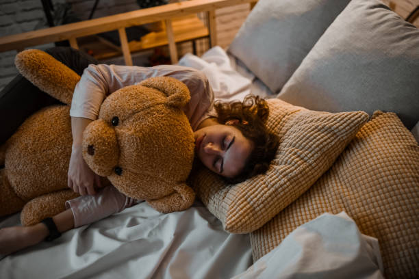 istock Teddy Bear Helping Female Scared Of Sleeping Alone 1838278833