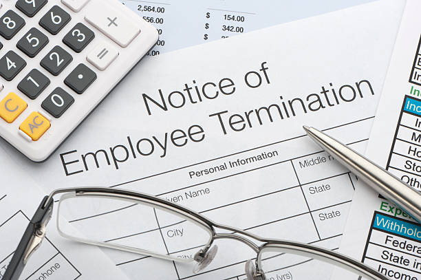 Close up of Employee termination form Close up of Employee termination form with pen and calculator firing stock pictures, royalty-free photos & images