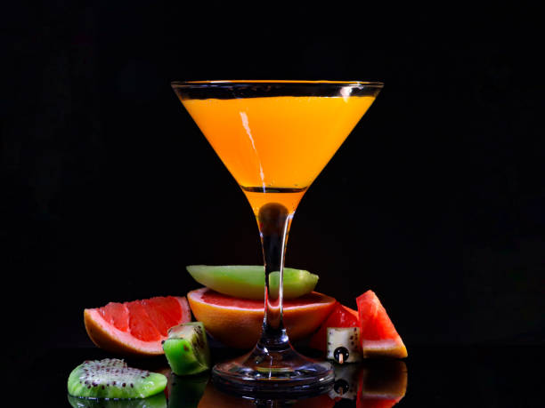 istock Orange juice with kiwi and grapefruit presentationOrange juice with kiwi and grapefruit in martini glass 1838284609