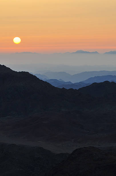 Beautiful sunrise seen from Mount Sinai over the rugged mountains