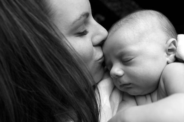 istock Mother Kissing Newborn Son 183828614