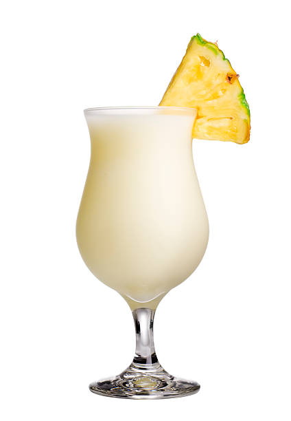 Pina Colada Pina colada isolated on white.  Please see my portfolio for other tropical drinks. fruit garnish stock pictures, royalty-free photos & images