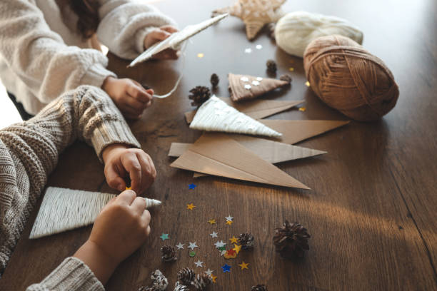 istock Children making Christmas decorations from yarn 1838291042