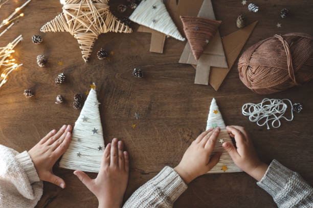 istock Children making Christmas decorations from yarn 1838291067