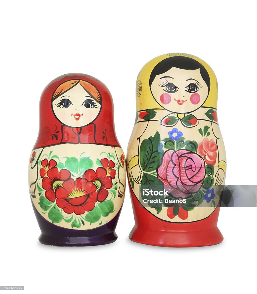 Girlfriends Two babushka dolls on white background. Russian Nesting Doll Stock Photo