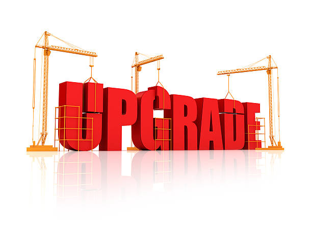 istock Big bulky red letters on an orange crane saying upgrade 183829451