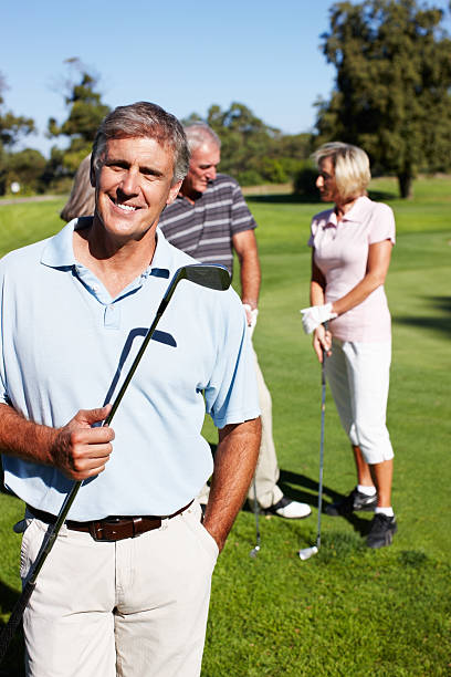 istock Happy man with golf club 183829659