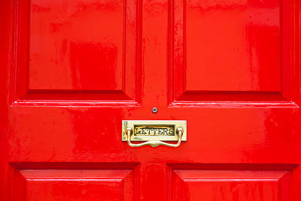istock Bright red painted door with brass letterbox horizontal 183829674