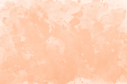 Peach fuzz watercolor textures on white paper background. Paint leaks and ombre effects. Hand painted abstract backdrop. Textured colorful painting. Trendy color.