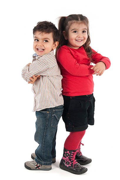 Sister and brother with Down Syndrome. Isolated on white.