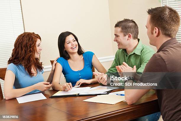 Friends Congratulating Friend During Study Group Time Stock Photo - Download Image Now