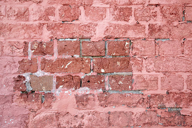 istock Old red and pink brick wall texture background 183830319