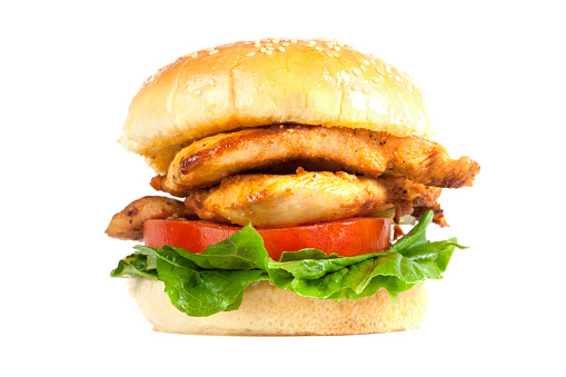 A Juicy Chicken Burger with tomato and lettuce. Isolated on white. XXL file size available. 